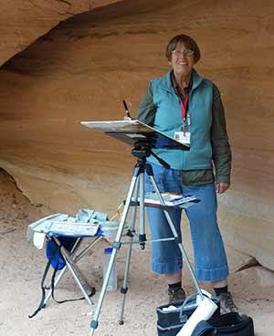 Artist painting in Cave